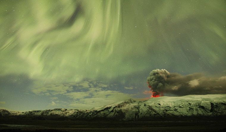 2010: year in pictures: Northern Lights above the ash plume of Iceland's Eyjafjallajokull volcano