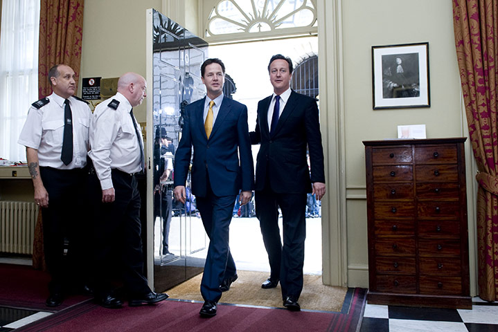 2010: year in pictures: DDavid Cameron and Nick Clegg enter No 10 after announcing the coalition