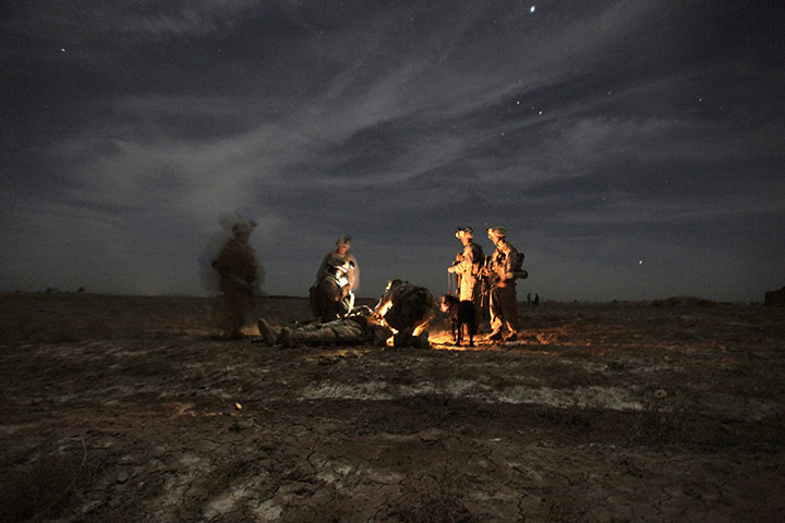 2010: year in pictures: US marines attend a comrade wounded by an IED in Helmand province