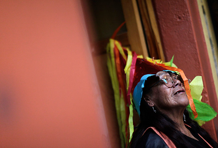 24 hours in pictures: Woman wears a piece of pinata as a hat in Mexico City