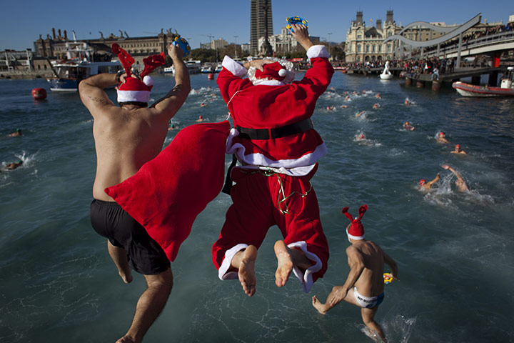 24 hours in pictures: Santas go for a swim in Barcalona