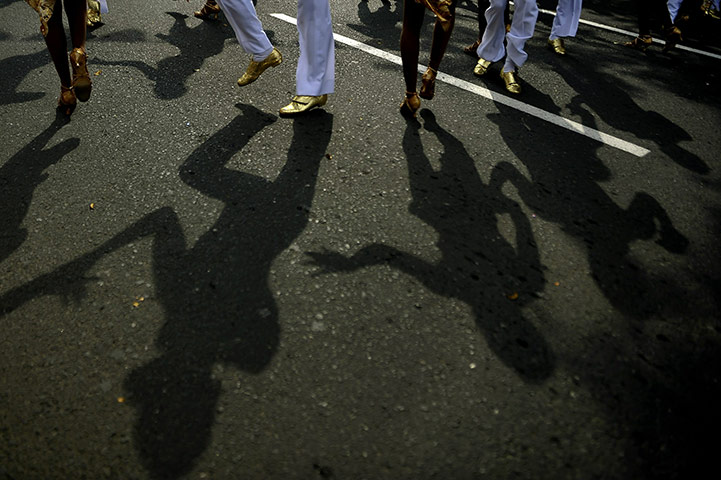 24 hours in pictures: Dancers perform during the Salsodromo parade, Colombia