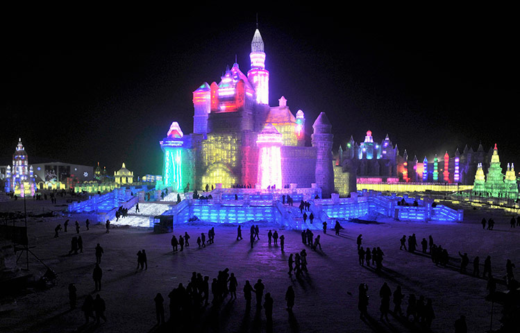 24 hours in pictures: Tourists look on prior to Harbin International Ice and Snow Festival