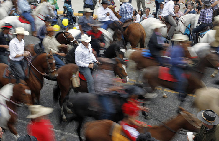 24 hours in pictures: Horses gallop down the streets of San Jose, Costa Rica