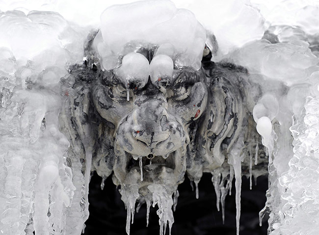 24 hours : Zurich, Switzerland: A fountain sculpture covered with ice