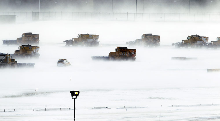 24 hours : Philadelphia, USA: Snow removal crews work to clear runways at the airport