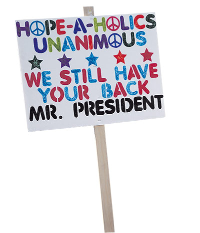 Placards of the year: A man holds a sign supporting Obama on the National Mall in Washington