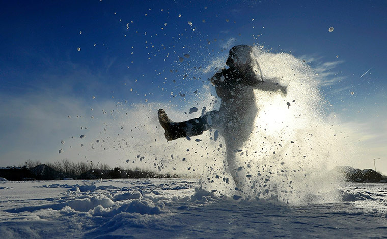 More Snow: Archie Kirk plays in the snow as his sch