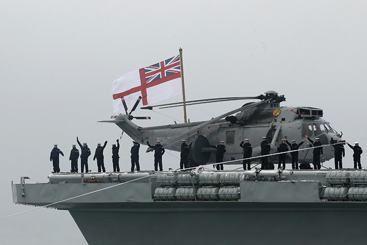 Ark Royal Farewell: Sailors wave to crowds from HMS Ark Royal as she enters Portsmouth harbour