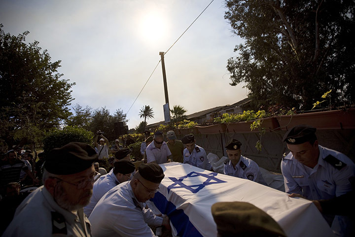 Israel Forest Fires: Prison guards carry the coffin of Eran Weizel, killed by a wildfire