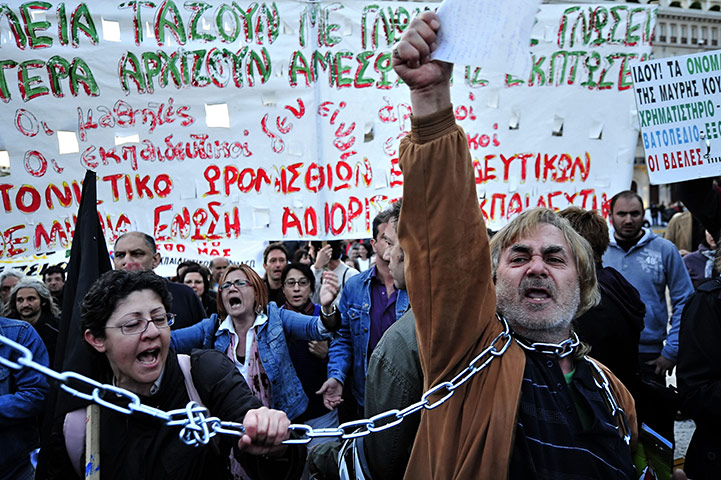 Year in business: Demonstrators shout slogans against government's austerity measures, Greece