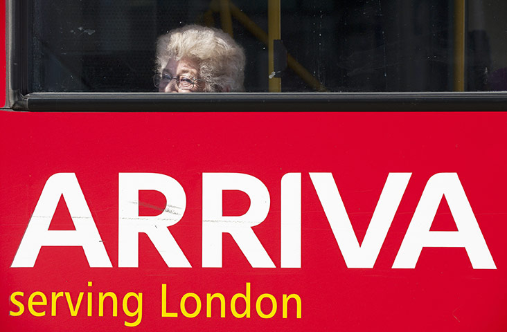 Year in business: A passenger looks from the window of an Arriva Plc bus