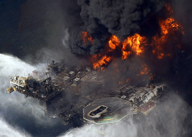 Year in business: Deepwater Horizon oil rig is seen burning
