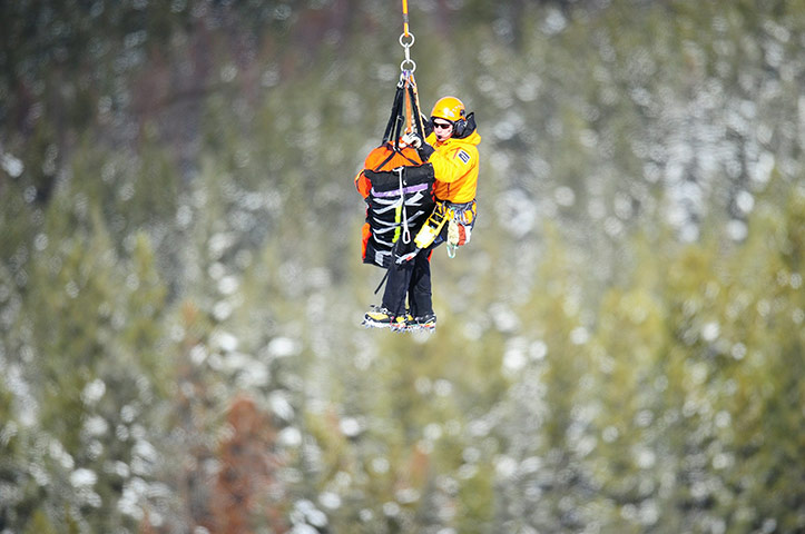 24 hours in pictures: Rescue workers evacute British skier Chemmy Alcott