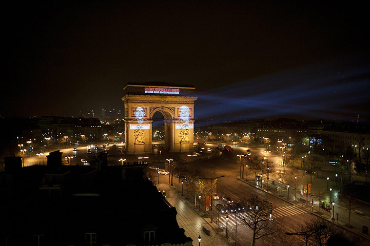 24 hours in pictures: Paris, France: Portraits of two French journalists abducted in Afghanistan