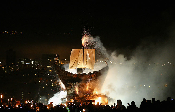 24 hours in pictures: Edinburgh, Scotland: Revellers gather on Calton Hill