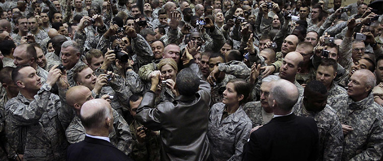 24 Hours: President Barack Obama greets troops during a rally in Afghanistan