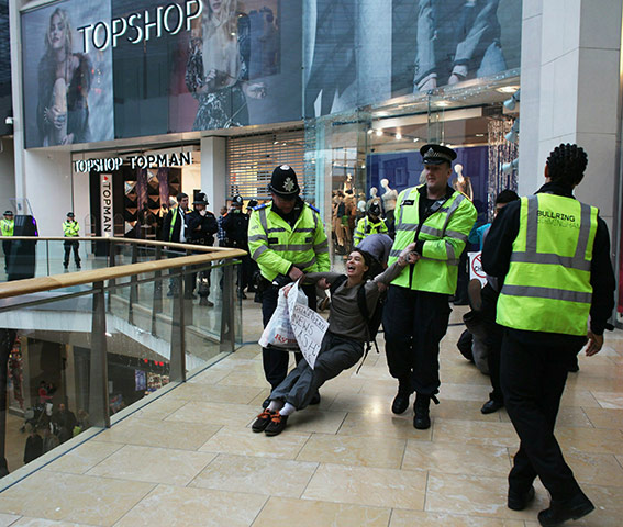 Uk Uncut: Protesters removed by police and security guards from Topshop in Birmingham