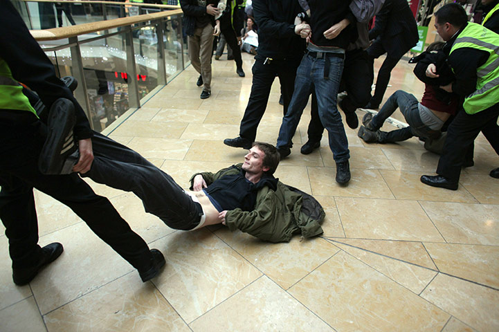 Uk Uncut: Protesters removed by police and security guards from Topshop in Birmingham