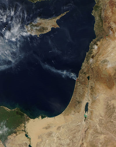 Israel forest fire: Satellite image of a trail of smoke drifts away from a forest fire, Israel