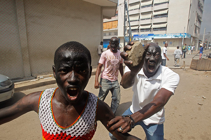 24 hours in pictures: Supporters of Ivory Coast opposition leader Alassane Ouattara