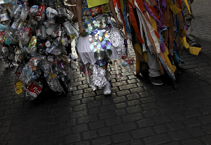 COP16 protest: Activists dressed in outfits made of plastic containers for Cancun