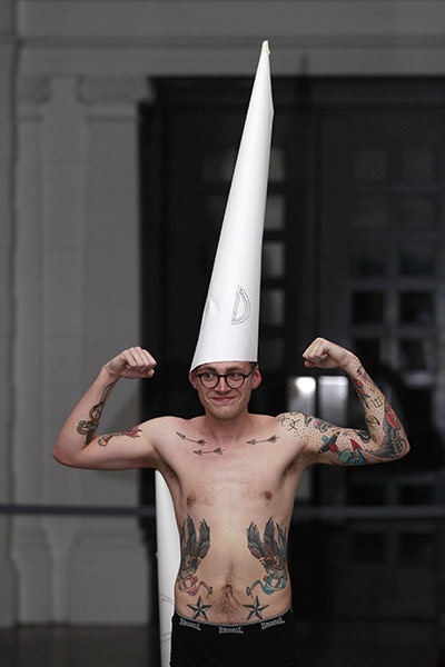 turner prize: A demonstrator flexes his muscles during a protest at the Tate Britain