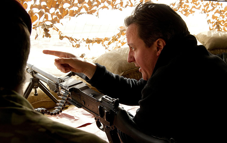 Cameron in Afghanistan : David Cameron surveys a nearby village from the top of a sangar observation