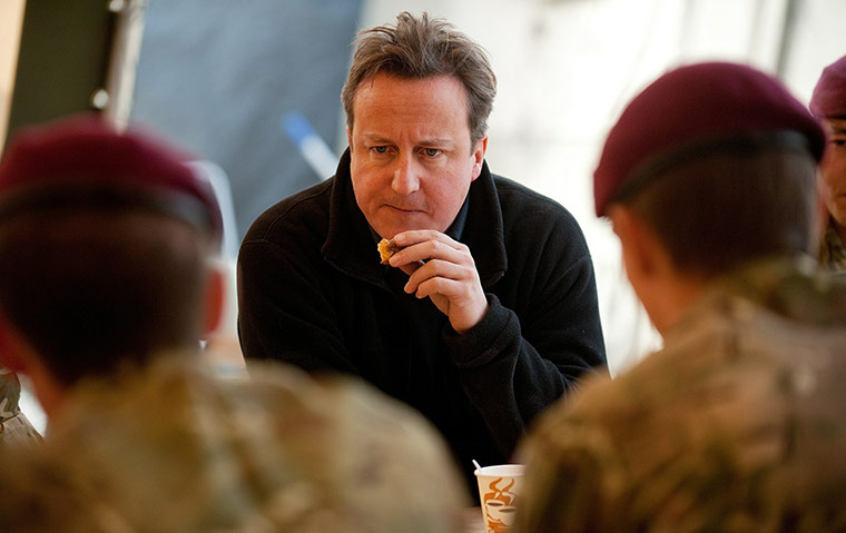 Cameron in Afghanistan : David Cameron speaks with soldiers from 2 Para in the cookhouse