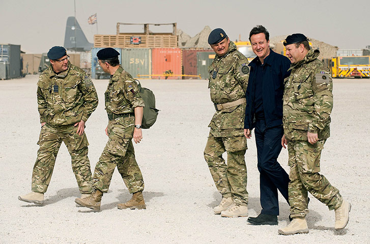 Cameron in Afghanistan : David Cameron smiles as he arrives at patrol base 2 