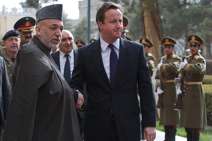 Cameron in Afghanistan : David Cameron shakes hands with Afghanistan's President Hamid Karzai 