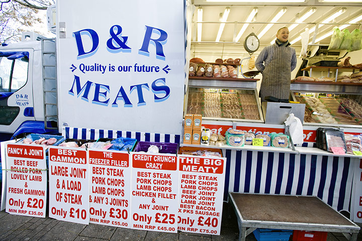 Spending cuts: A cheap butcher in street market Clifton, Nottingham