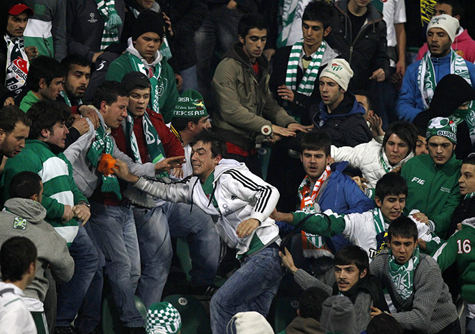 Tuesday Champions League: Bursaspor fans fight during their Champions League match against Rangers 