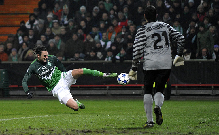 Tuesday Champions League: Werder Bremen's Hugo Almeida stretches but can't reach the ball