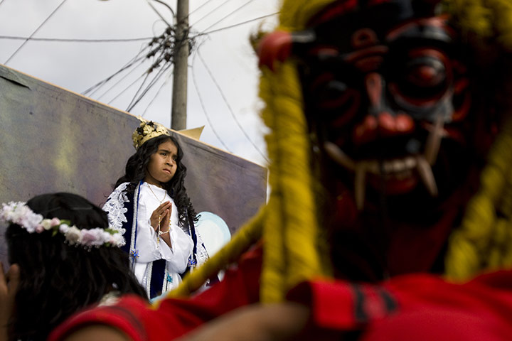 24 hours: Antigua Guatemala, Guatemala: People wearing costumes of angels and devils