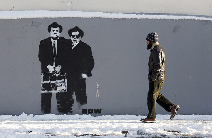 Year in Business: Graffiti depicting Brian Lenihan and Brian Cowen in Dublin