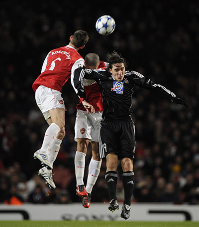 Arsenal v Partizan: Koscielny, Denilson and Cleo go up for a header