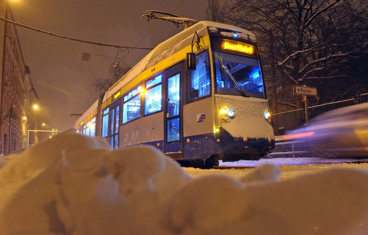 Cold weather abroad: Leipzig, Germany: A streetcar stopped by an ice-coated contact line