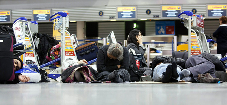 Cold weather abroad: Frankfurt am Main, Germany: Passengers sleep on the floor at the airport