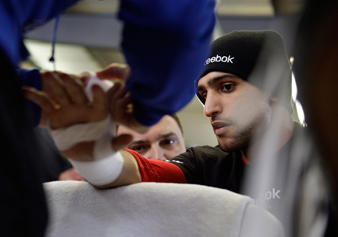24 hours in pictures: WBA super lightweight champion Amir Khan of England has his hands wrapped