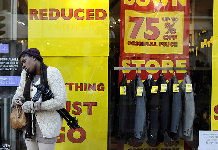 Business week in pictures: A shop displays sale signs on Oxford Street in central London