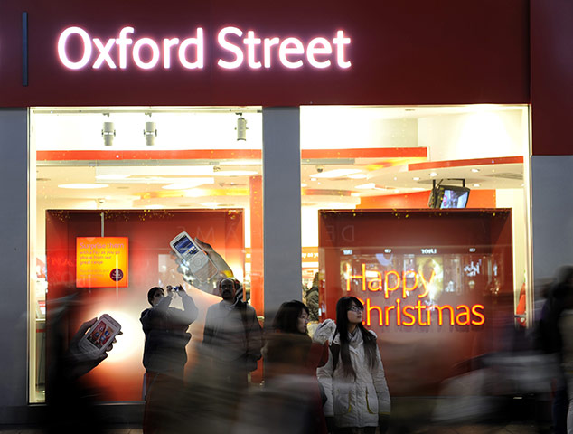 Business week in pictures: Chritsmas shoppers walk along Oxford street in central London