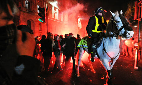 Mounted riot police clash with protesters