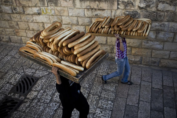 24 hours : Jerusalem: Locals carry bread in the Old City