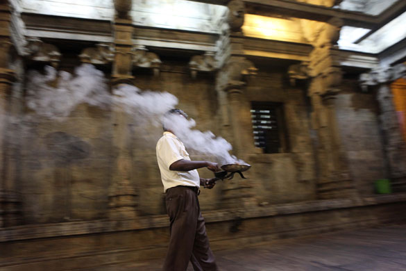 24 hours : Colombo, Sri Lanka: A Tamil offers prayers at a Hindu temple