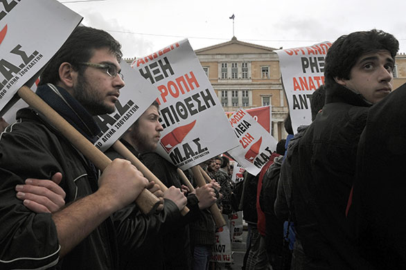 Greek strike: Demonstrators march in front of the Greek Parliament