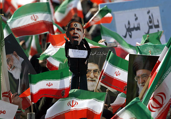 Iran 31st anniversary: Iranians hold a caricature of Barack Obama 31st 1979 anniversar