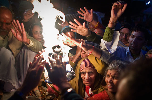 24 hours in pictures: Haridwar, India: Hindu devotees receive blessings
