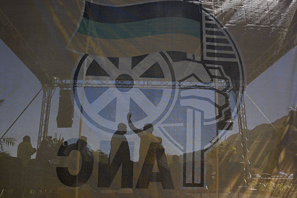 Mandela celebrations: People seen through an ANC flag