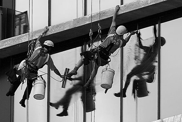In Pictures: Clean: Reader's photo of two people on a harness cleaning windows on a tower block